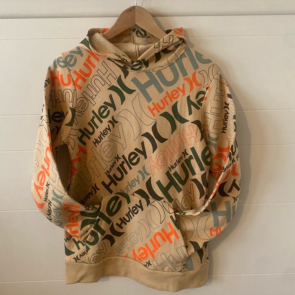 Kids ex large, could fit an adult sm. Hurley hooded sweatshirt with pockets.